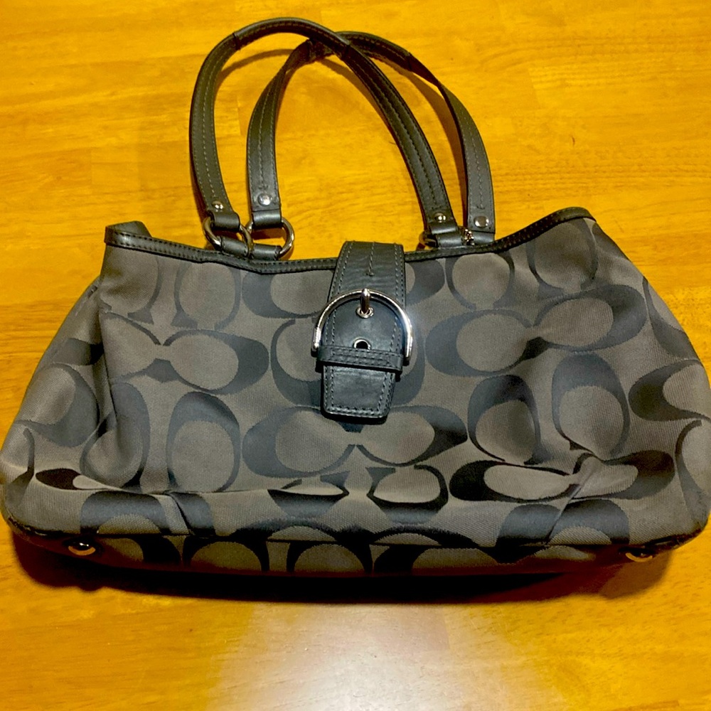 Authentic Coach footed shoulder bag.